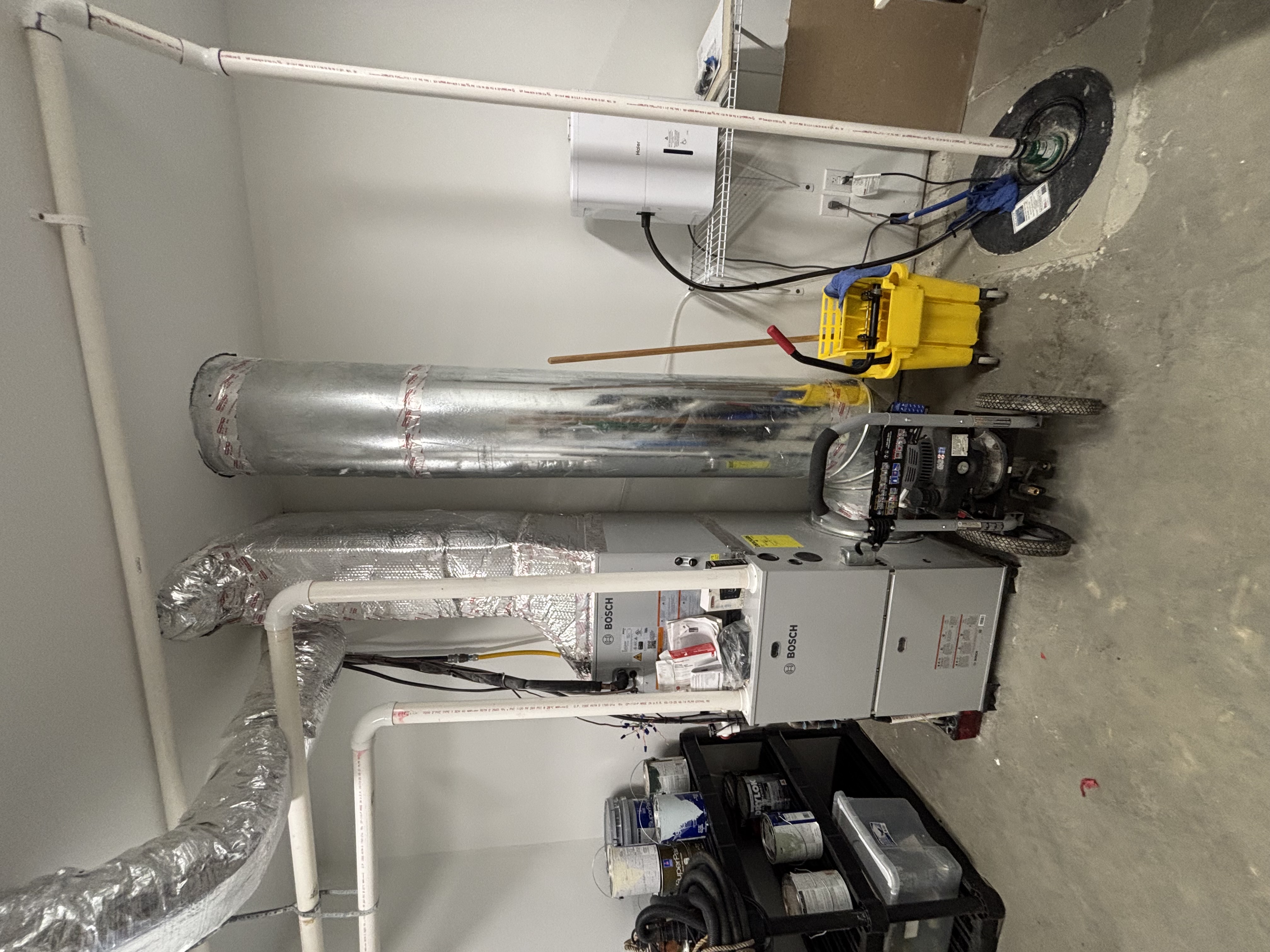 Trane furnace filter cabinet and forced-air equipment in a mechanical space.