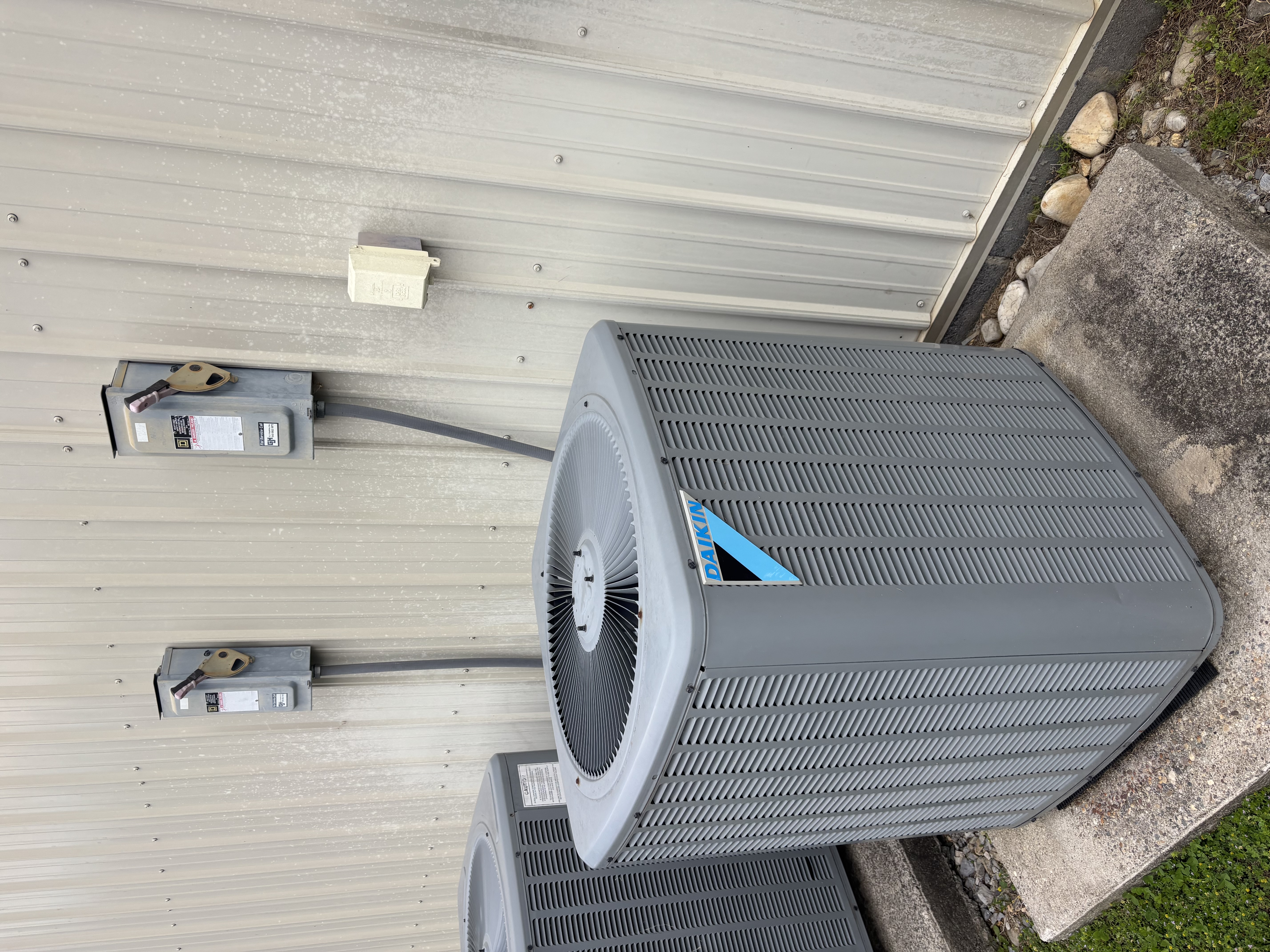 Outdoor heat pump disconnects and service equipment for a light commercial HVAC system.