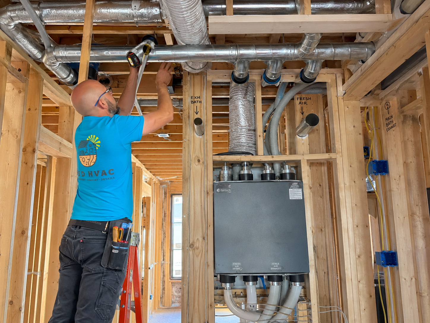 Ventilation and ductwork rough-in in a framed new construction home.