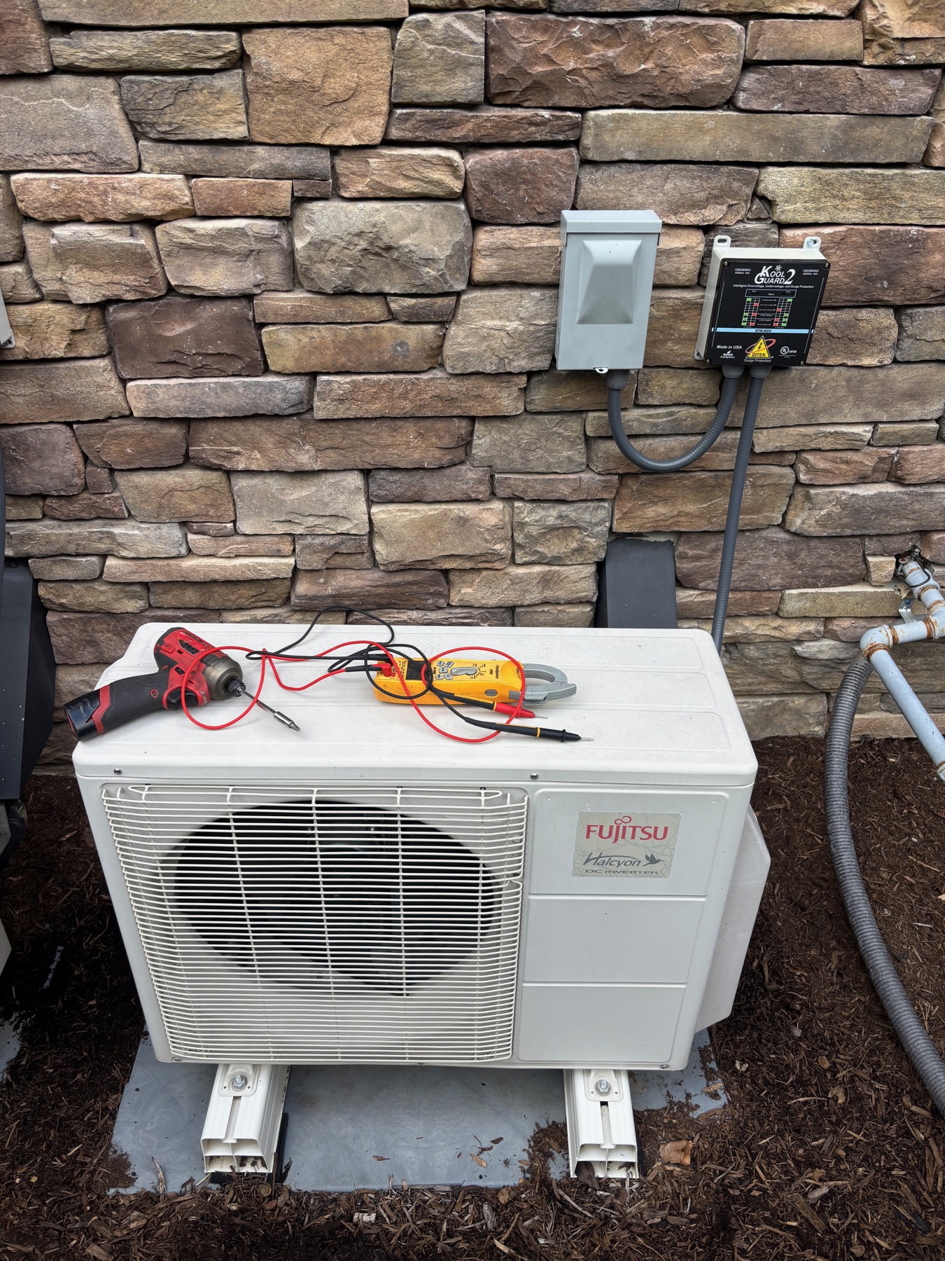 Heat pump commissioning detail checked during OCD HVAC installation work.